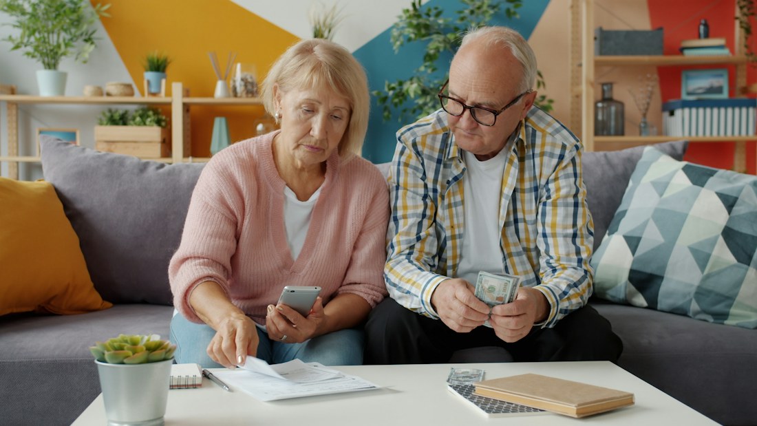 A couple reviewing documents together at home